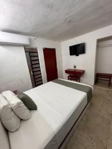 Postel nebo postele na pokoji v ubytování Hotel Margarita