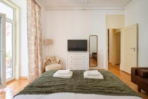 Postel nebo postele na pokoji v ubytování Lisbon Lodge