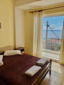 Postel nebo postele na pokoji v ubytování Tasos Manaritsas Rooms