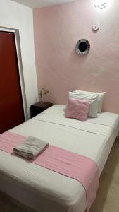 Postel nebo postele na pokoji v ubytování Hotel Margarita