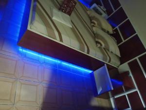a room with a blue light on a building at Hotel Endless Love in Carapicuíba