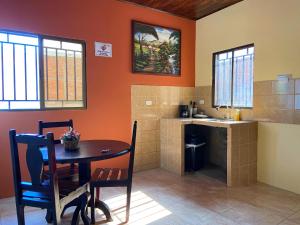 a kitchen with a table and a sink at Hospedaje Coffee and cocktails in Estelí