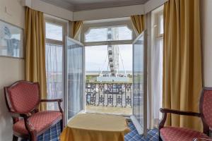 a room with a window with a view of the eiffel tower at Royal Hotel Great Yarmouth in Great Yarmouth