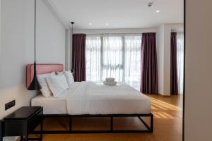Ein Bett oder Betten in einem Zimmer der Unterkunft PAREA Athens
