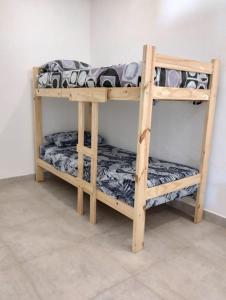 two bunk beds sitting next to each other at Casa Nuestra Hostal in Salta