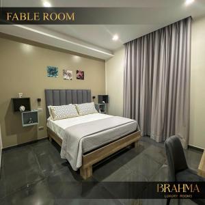 Ein Bett oder Betten in einem Zimmer der Unterkunft Brahma Luxury Rooms