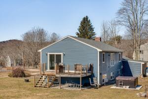 a blue house with a porch and a deck at Over Andover Retreat with Hot Tub Walk to Lake! in Andover