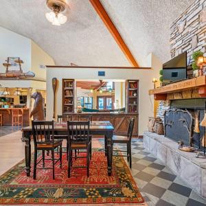 a dining room with a table and chairs and a fireplace at Budget Friendly Sleeps 8 Discounts Available in Tampa