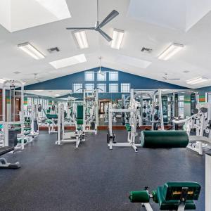 a gym with a lot of equipment in it at Budget Friendly Sleeps 8 Discounts Available in Tampa