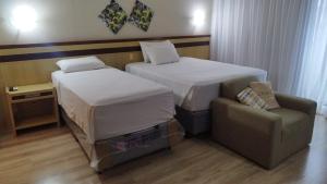 Lets Idea Hotel Flat Particular客房内的一张或多张床位