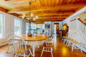 a kitchen and dining room with a table and chairs at Timberbrook in Dorset