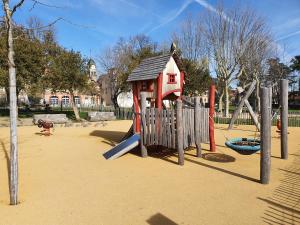 a playground with a play equipment in a park at Gîte Les Arches in Saint-Andéol-le-Château