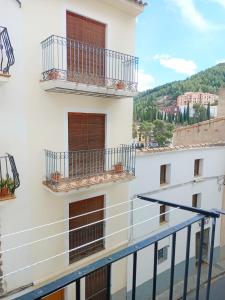 a balcony with two balconies on a white building at Ca l'Èndula II in Lucena del Cid