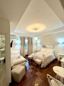 a bedroom with two beds and a table and chairs at La Magnolia 140 in Fiumicino