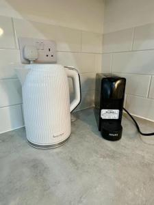 a toaster and a blender sitting on a counter at Comfort and Style ! in Addington