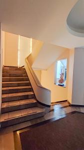 a staircase in a building with a stair case at Hotel Roosevelt Condesa in Mexico City