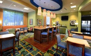 a dining room with a large table and chairs at Hampton Inn Roxboro in Roxboro