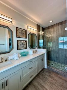 a bathroom with a sink and a shower at Sunshine retreat Elevated New Build walkable to everything including BEACH in Fort Myers Beach