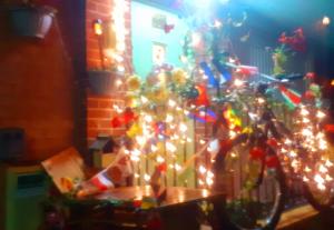 a bike decorated with christmas lights in a room at Marina,Families are welcome in East Cowes