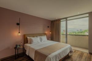 Ένα ή περισσότερα κρεβάτια σε δωμάτιο στο Sites Hotel