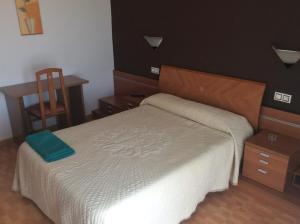 Postel nebo postele na pokoji v ubytování Hostal Juli