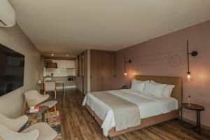 Ένα ή περισσότερα κρεβάτια σε δωμάτιο στο Sites Hotel