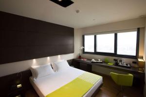 Voodi või voodid majutusasutuse Best Western Plus The Hub Hotel toas