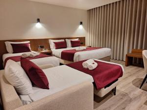 Postel nebo postele na pokoji v ubytování 3M Hostel & Suites
