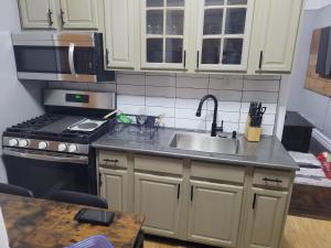 a kitchen with a sink and a stove at Chilltown in Wakefield