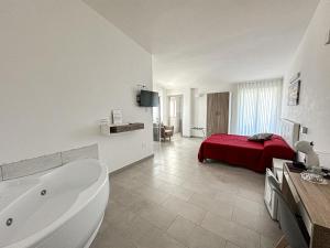 Postel nebo postele na pokoji v ubytování Valle degli Ulivi B&B