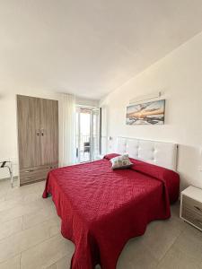Postel nebo postele na pokoji v ubytování Valle degli Ulivi B&B