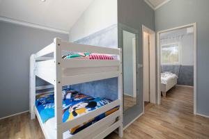 a bedroom with two bunk beds and a mirror at Holiday home in Gajana - Istrien 50093 in Gajana +32 photos