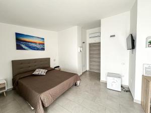 Postel nebo postele na pokoji v ubytování Valle degli Ulivi B&B