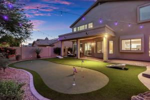 a house with a putting green with a golf course at Pool, Putting Green, Arcade, Cornhole, Great Location at Phoenix Desert Ridge Retreat! in Phoenix