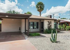 a house with a palm tree in front of it at Great Location Near Local Bars & Museums and Private Patio- Phoenix Casa GQ in Phoenix