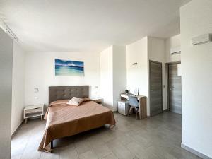 Postel nebo postele na pokoji v ubytování Valle degli Ulivi B&B