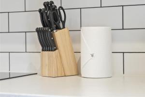 a knife block next to a roll of paper towels at Free Parking Ideal for solo business travellers in Ilkeston