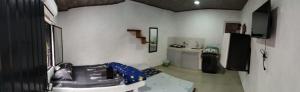 a room with a room with a play room with a floor at Hospedaje Luz d' Luna in Puerto Triunfo
