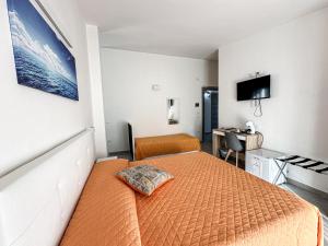 Postel nebo postele na pokoji v ubytování Valle degli Ulivi B&B