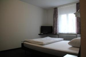 Postel nebo postele na pokoji v ubytování Hotel Linde