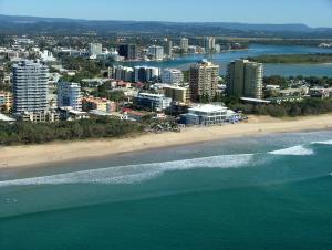 an aerial view of a beach and the ocean at Majorca Isle Beachside Resort in Maroochydore