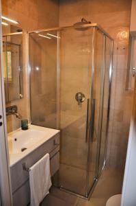 a bathroom with a shower and a sink at Bramante Suites Urbino in Urbino