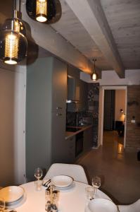 a kitchen with a table with two plates on it at Bramante Suites Urbino in Urbino