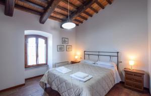 a bedroom with a bed with two towels on it at Awesome Apartment In Gubbio With Wifi in Gubbio