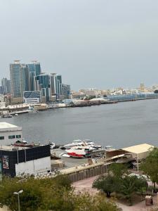 a view of a marina with boats in the water at Tranquil Haven:King Bed, Ensuite, Master Bedroom in Ajman 