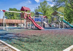 a playground with a slide at 1BR Apartment near Ark Encounter with Parking in Dry Ridge