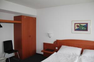 Postel nebo postele na pokoji v ubytování Hotel Linde