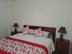 Un pat sau paturi într-o cameră la Departamento 207 Altamar 2