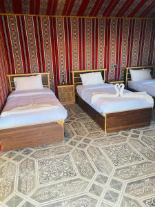 Voodi või voodid majutusasutuse Moon Rum LuxuryCamp toas