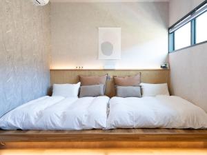 A bed or beds in a room at West Shore Plus
